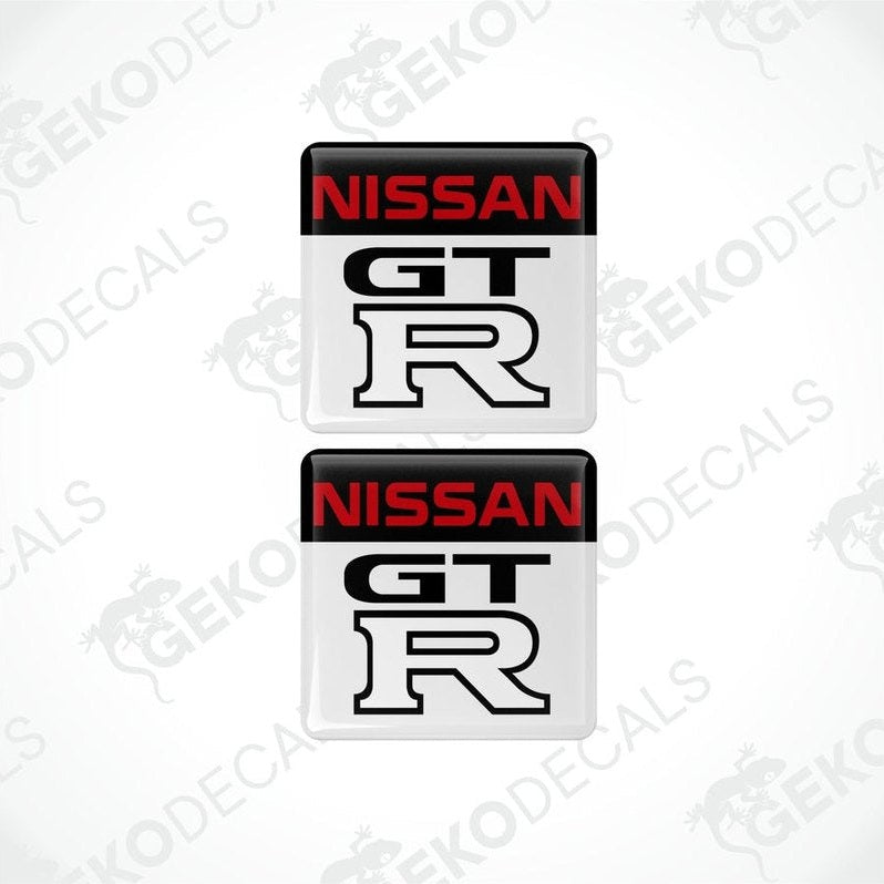 Two nissan gt r vinyl stickers with a black, red, white, and gray color scheme.