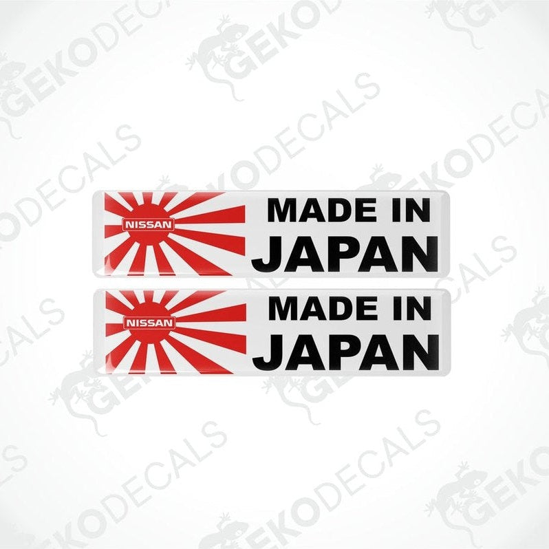 Two vinyl stickers with a red and white design, featuring the text 'MADE IN JAPAN' and a red circle, indicating nationality or origin.