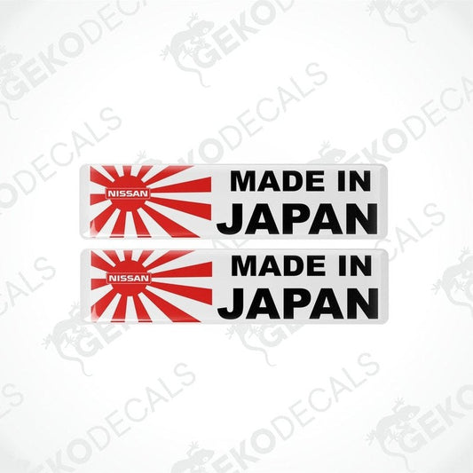 Two vinyl stickers with a red and white design, featuring the text 'MADE IN JAPAN' and a red circle, indicating nationality or origin.