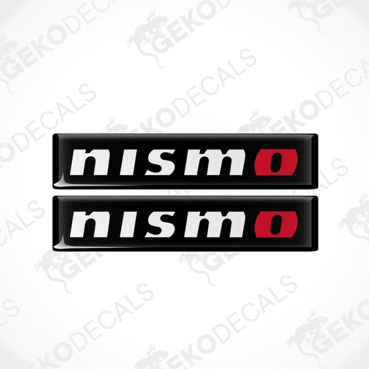 Two black, red, and white vinyl stickers with 'NISSAN NISMO' text and a logo.