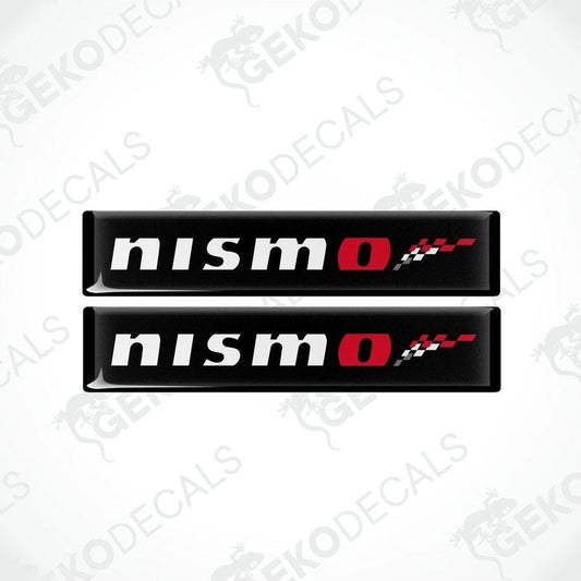 Two black vinyl stickers with red and white NISSAN NISMO logo design.