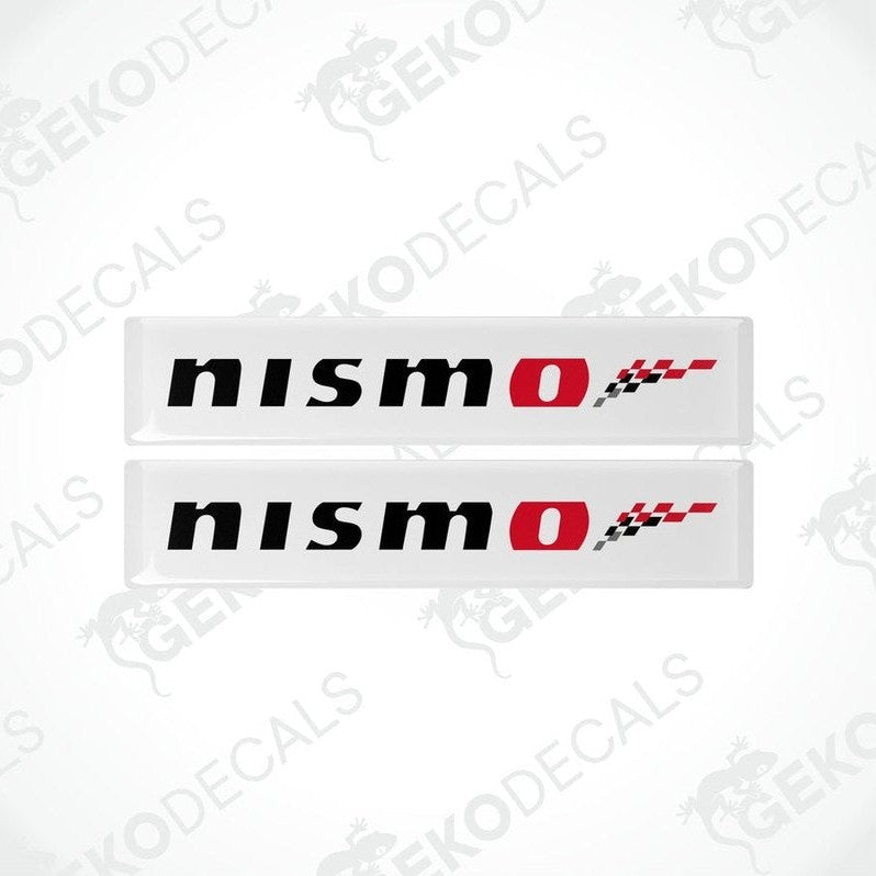 Two white vinyl stickers with red and black NISSAN NISMO logo design.