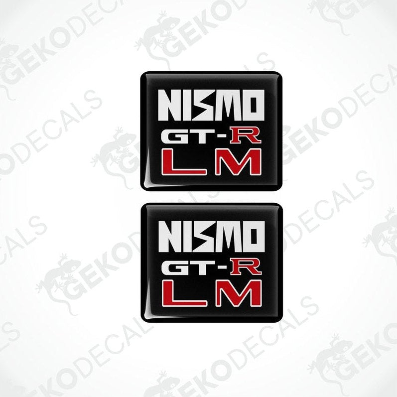 Two square black vinyl decals with 'NISMO GT-R LM' written in white and red text.