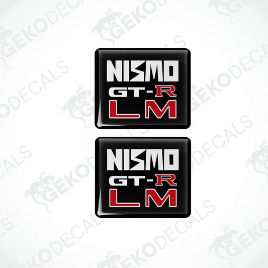 Two square black vinyl decals with 'NISMO GT-R LM' written in white and red text.