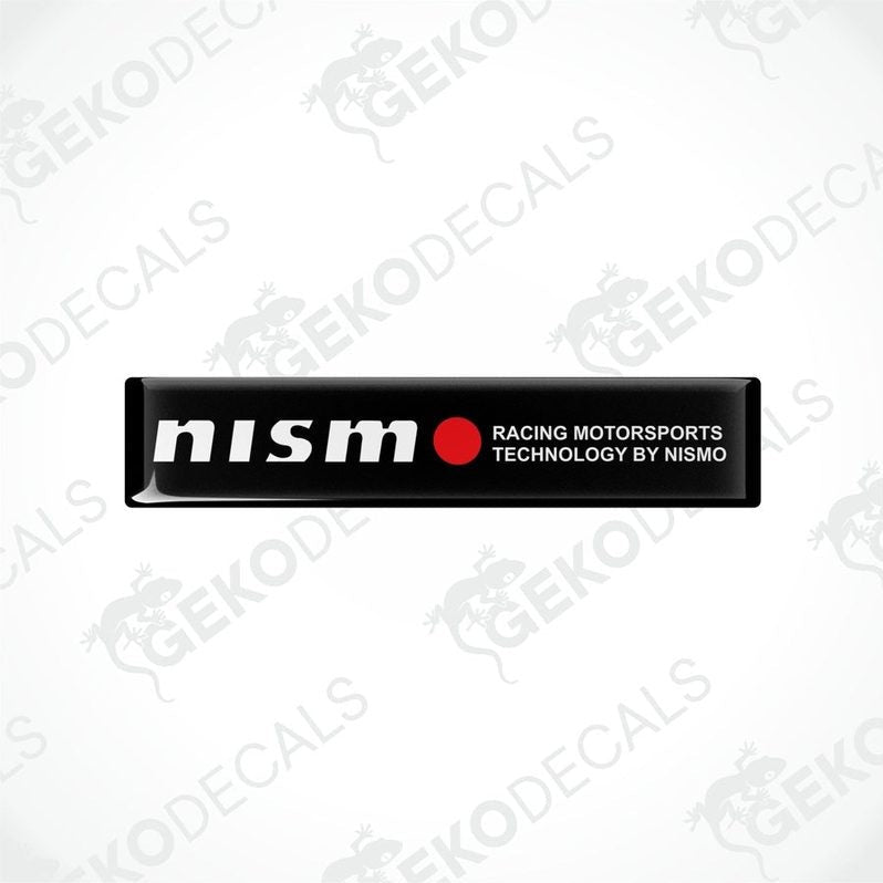 Black vinyl stickers with red and white text, including 'NISSAN' and 'RACING MOTORSPORTS TECHNOLOGY BY NISMO'. GeckoDecals logo is visible in the corner.