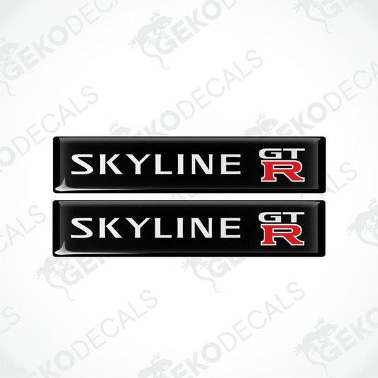 Two black, red, and white decals with the text 'SKYLINE GT R' on them, designed for vehicle use.