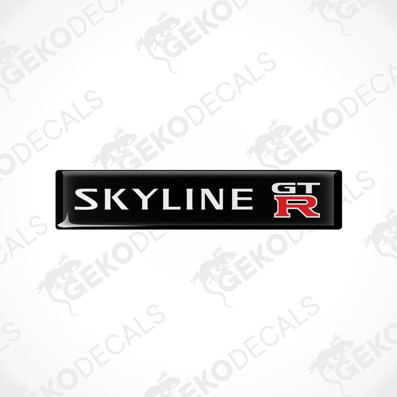 Two black, red, and white decals with the text 'SKYLINE GT R' on them, designed for vehicle use.