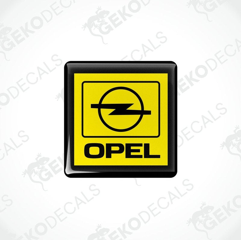 Yellow and black vinyl stickers with a geometric design representing the Opel brand logo.
