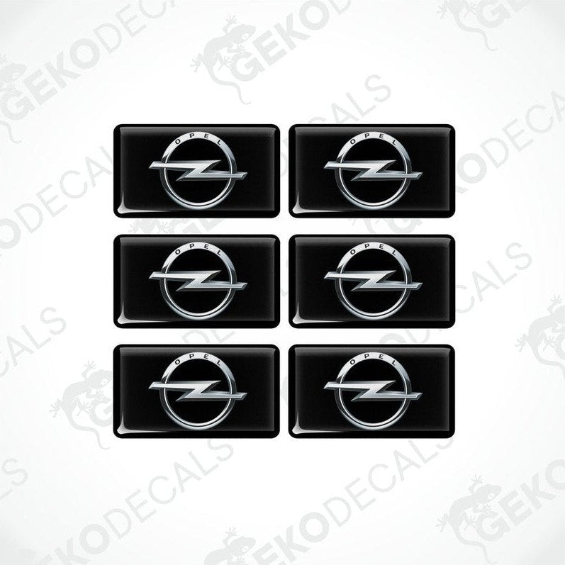 A set of six black vinyl decals with the Opel logo in silver.