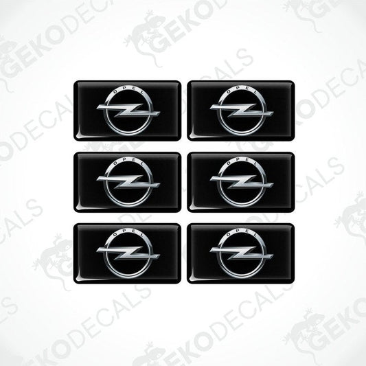 A set of six black vinyl decals with the Opel logo in silver.