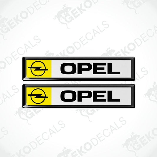 Two black vinyl stickers with the word 'OPEL' and a yellow and white emblem design on them.