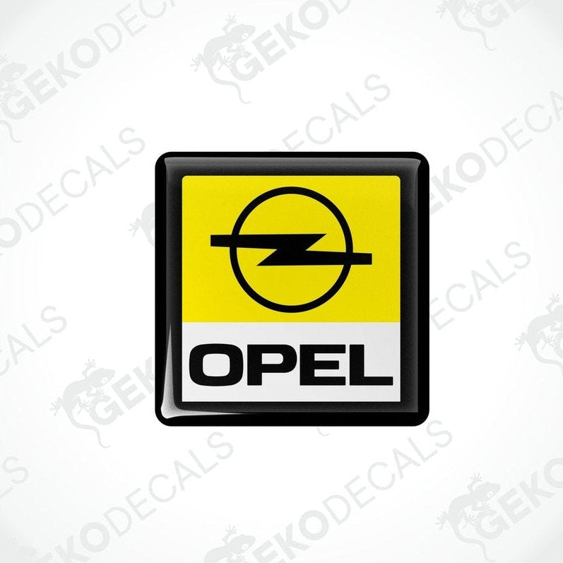  Yellow, black, and white vinyl stickers with the word 'OPEL' on them, one with a Gecko Decals logo at the bottom.