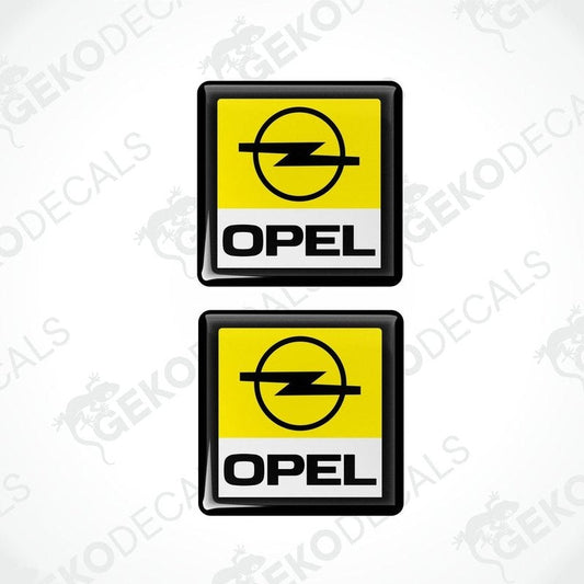 Two yellow, black, and white vinyl stickers with the word 'OPEL' on them, one with a Gecko Decals logo at the bottom.