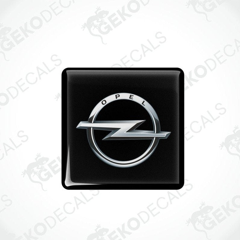 Black domed stickers with the Opel logo in silver.