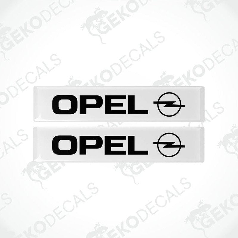 Two withe and black rectangular vinyl decals with the Opel logo.