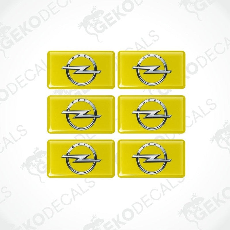 A set of six yellow vinyl decals with the Opel logo in silver.