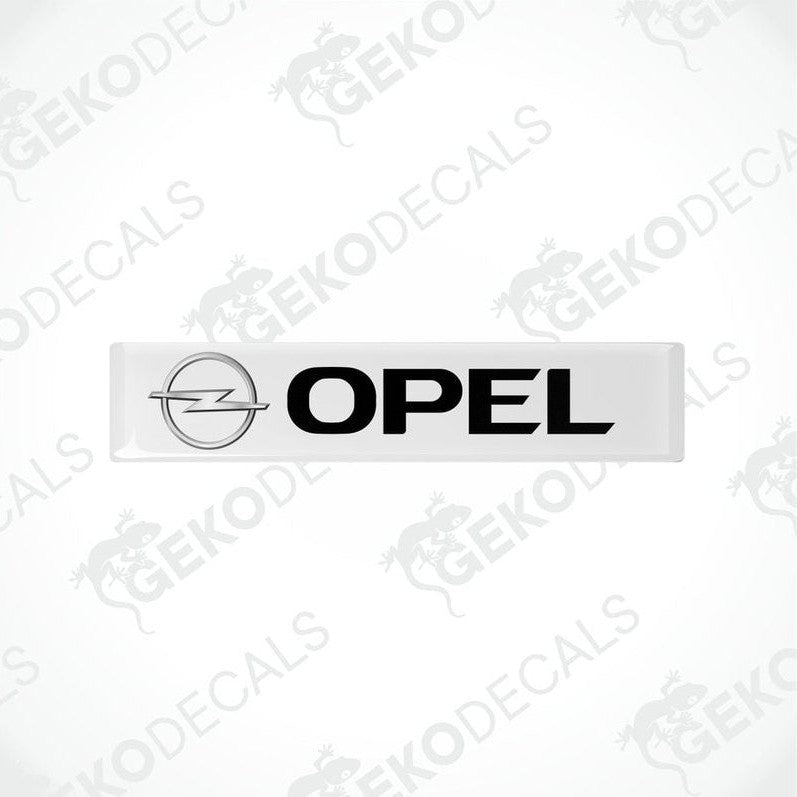 Withe vinyl stickers with the word 'OPEL' and the logo of the Opel brand on a black background.