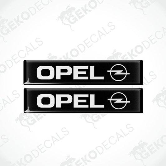 Two black and white rectangular vinyl decals with the Opel logo.
