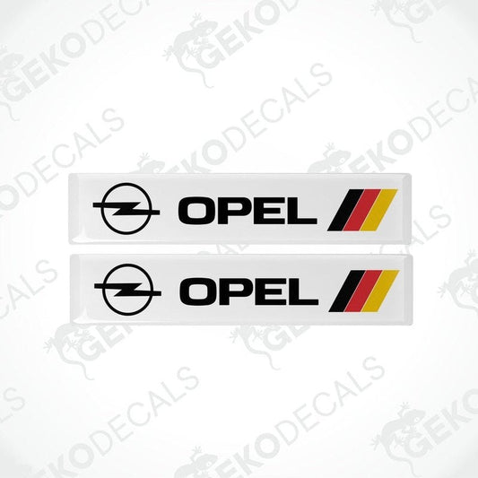 Two white vinyl stickers with red and black Opel brand decals and the word 'GERMANY' printed below.