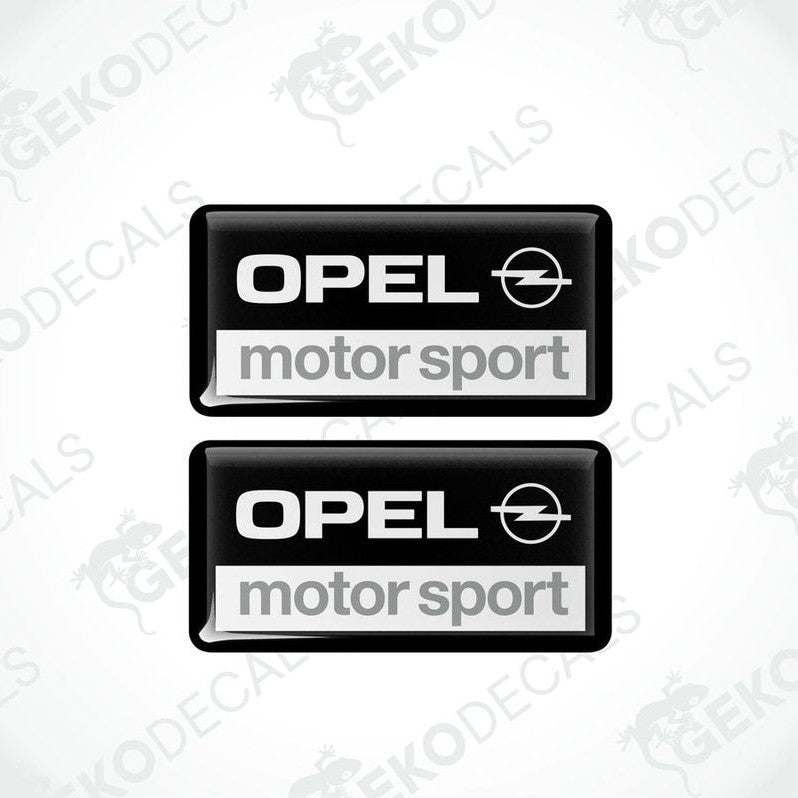 Two rectangular black vinyl decals with 'OPEL motor sport' text and the Opel logo.