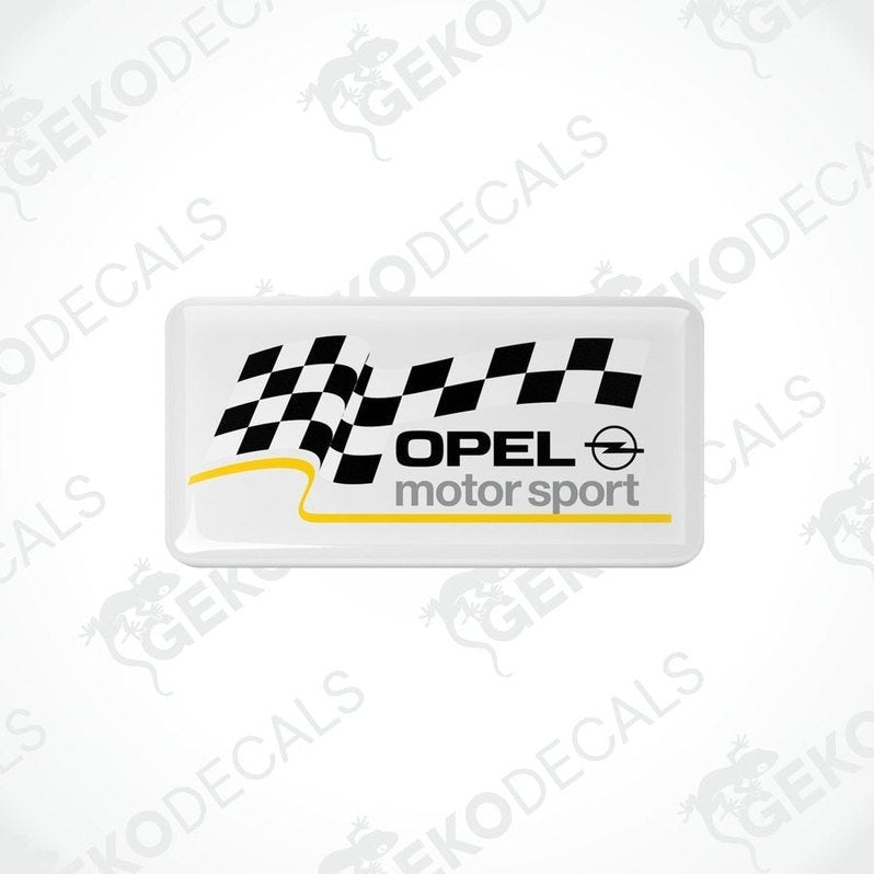 White vinyl stickers with checkered patterns and the text 'OPEL MOTORSPORT' printed on them.
