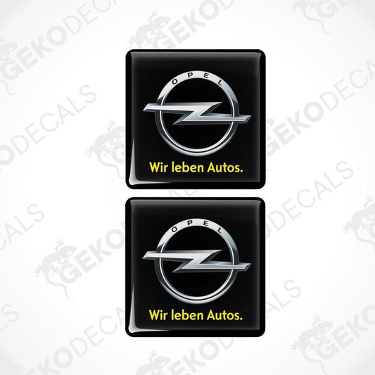 Two black vinyl stickers with the Opel brand logo and the text 'WIR LEBEN AUTOS'.