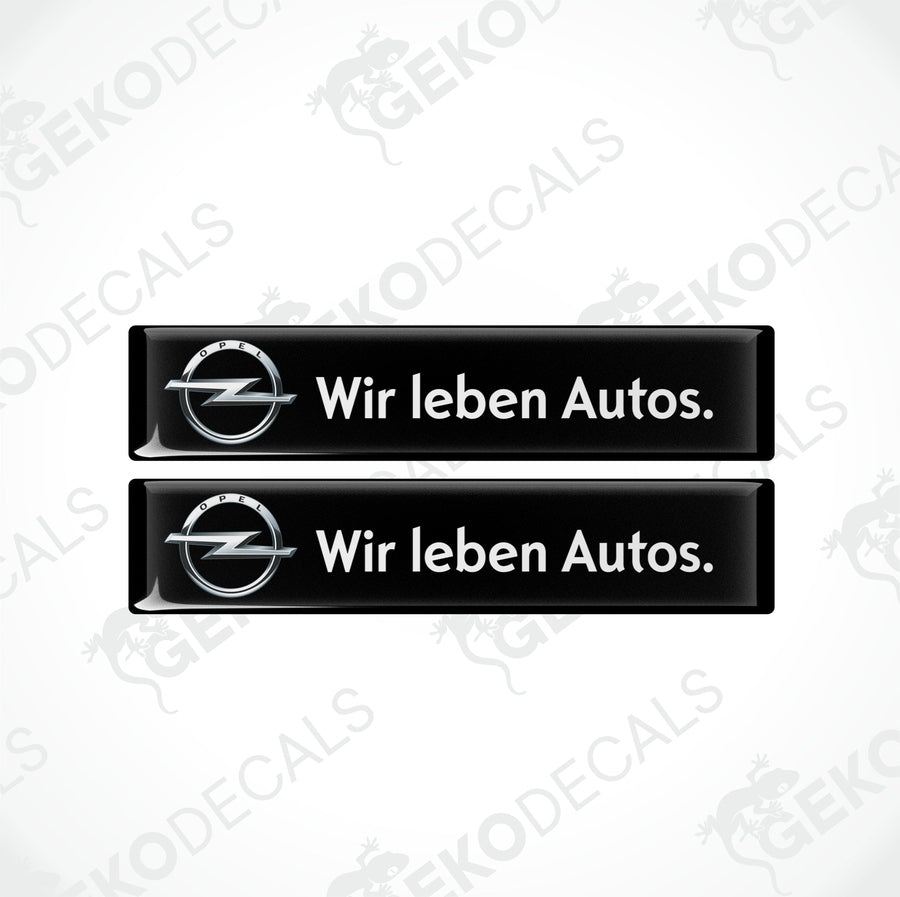 Two black vinyl stickers with the text 'WIR LEBEN AUTOS' and the Opel logo.