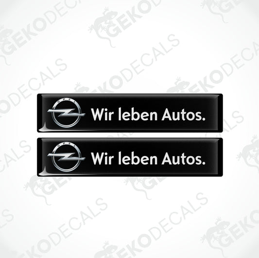 Two black vinyl stickers with the text 'WIR LEBEN AUTOS' and the Opel logo.