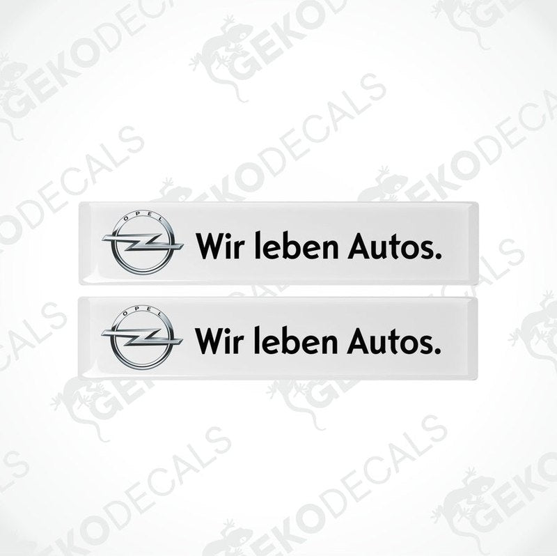 Two withe vinyl stickers with the text 'WIR LEBEN AUTOS' and the Opel logo.