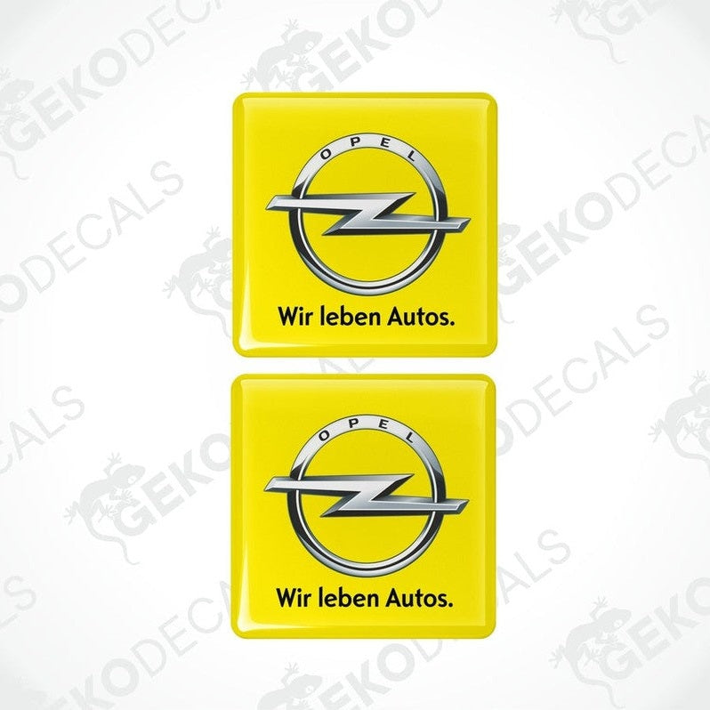 Two yellow vinyl stickers with the Opel brand logo and the text 'WIR LEBEN AUTOS'.
