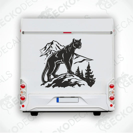 A decal of a black panther mountain scene on a white vehicle.
