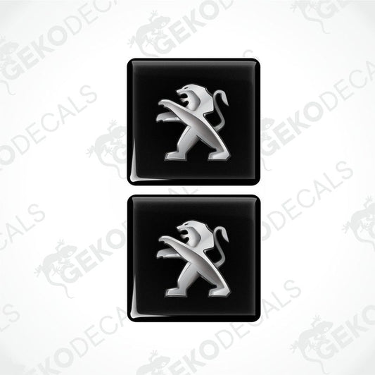 Two black vinyl stickers with a silver Peugeot logo, arranged horizontally.