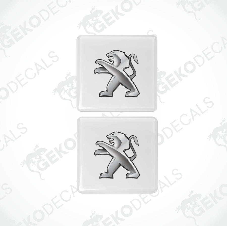 Two withe and silver vinyl stickers with a Peugeot logo and a lion graphic.