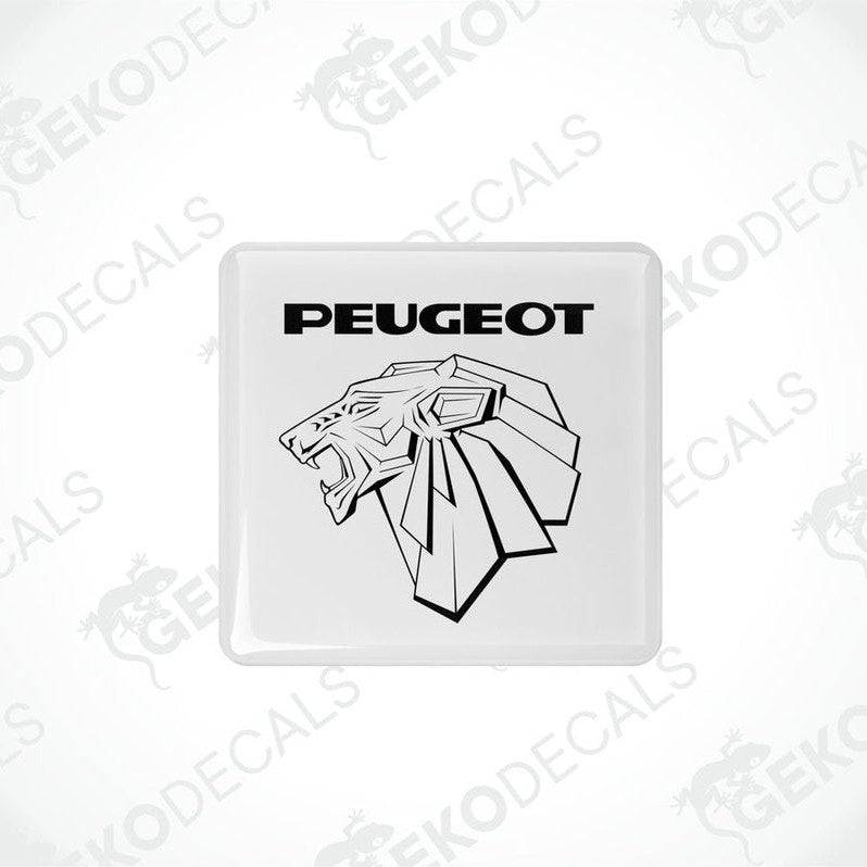 Withe vinyl stickers with a PEUGEOT logo, placed against a black background.