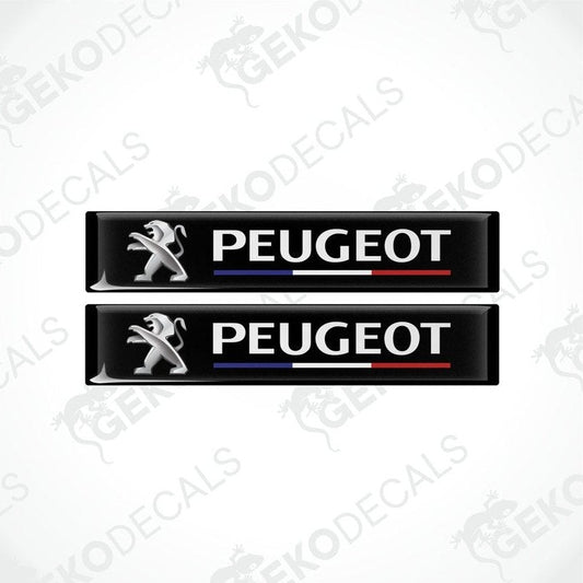 Two black vinyl decals with the PEUGEOT brand logo and the name 'FRANCE' featured in a stylized manner. The decals have a glossy finish and are designed for use as car stickers.