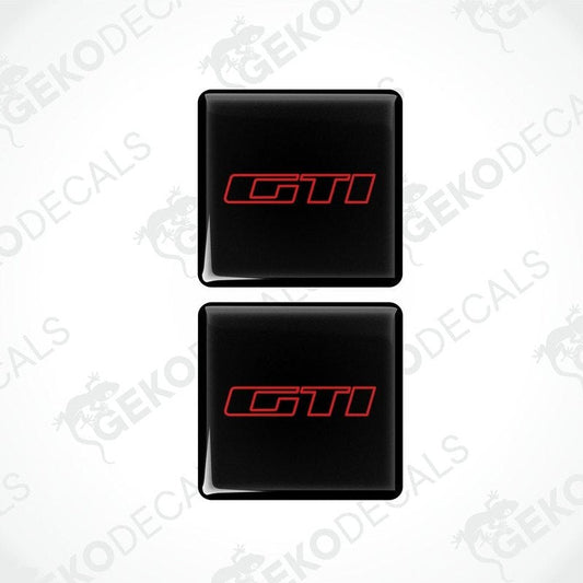 Two black vinyl stickers with the 'GTI' logo in red and white, placed on a white background.
