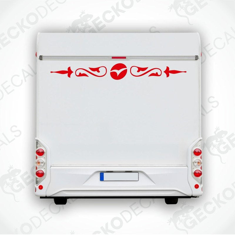 A white caravan with a red and black die cut decal on the rear side, featuring a geometric pattern.