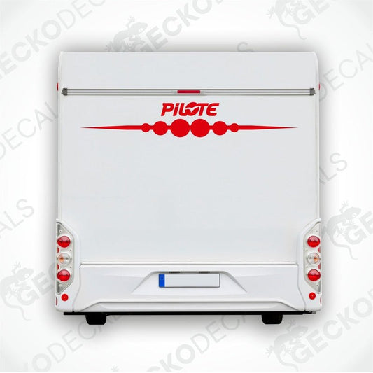 Rear view of a white caravan with the Pilote brand decal on the side.