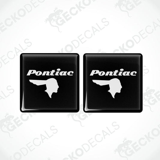 Two black vinyl stickers with a withe geometric design PONTIAC, displayed on a BLACK background.