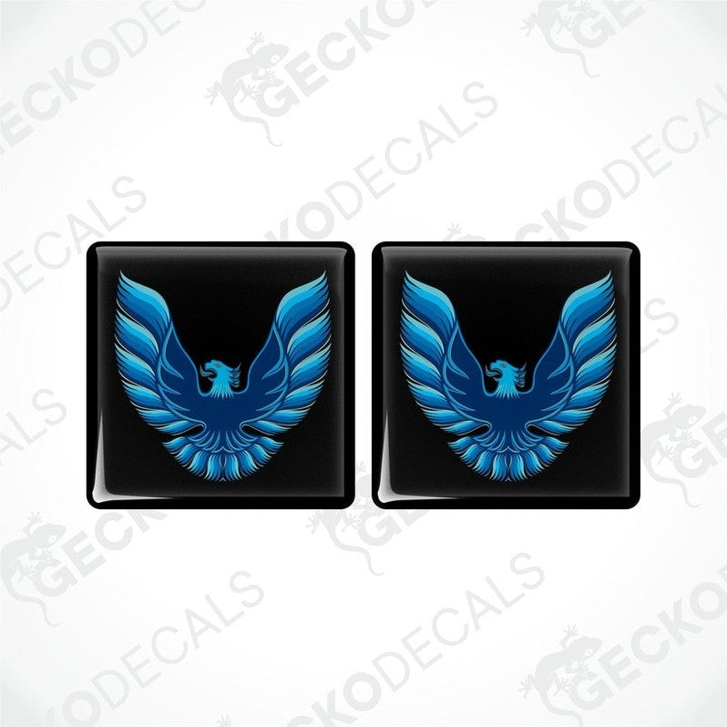 Two black vinyl stickers with a blue and white geometric design, displayed on a white background.