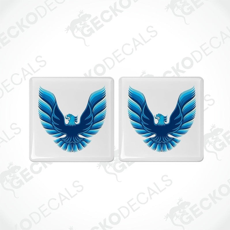 Two withe vinyl stickers with a blue and white geometric design, displayed on a white background.