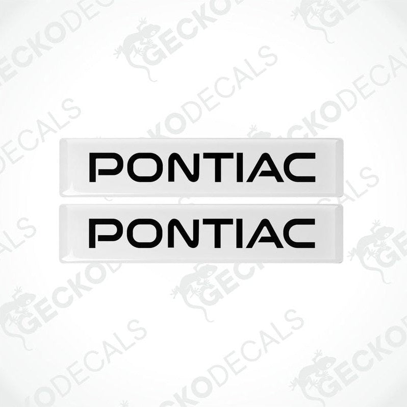 Two withe and black vinyl decals with the word 'PONTIAC' printed on them.