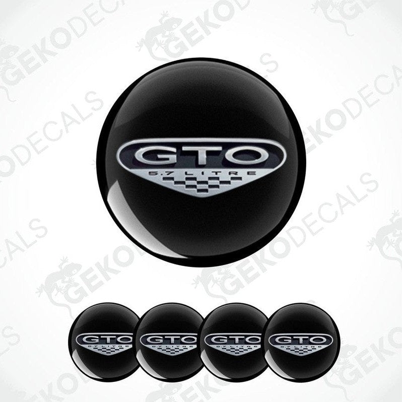 A set of four black vinyl stickers with the PONTIAC GTO logo printed on them.