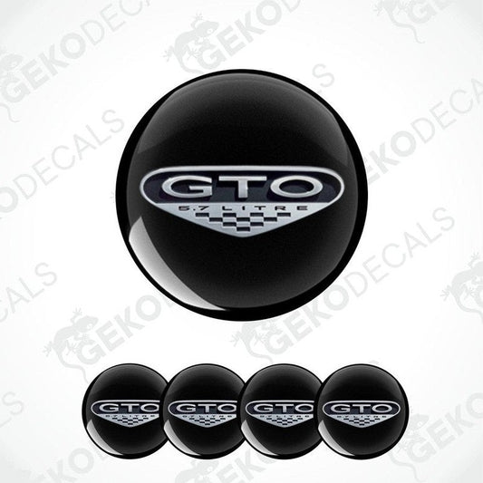 A set of four black vinyl stickers with the PONTIAC GTO logo printed on them.