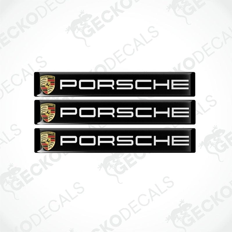 Three black vinyl stickers with the Porsche brand logo on each.
