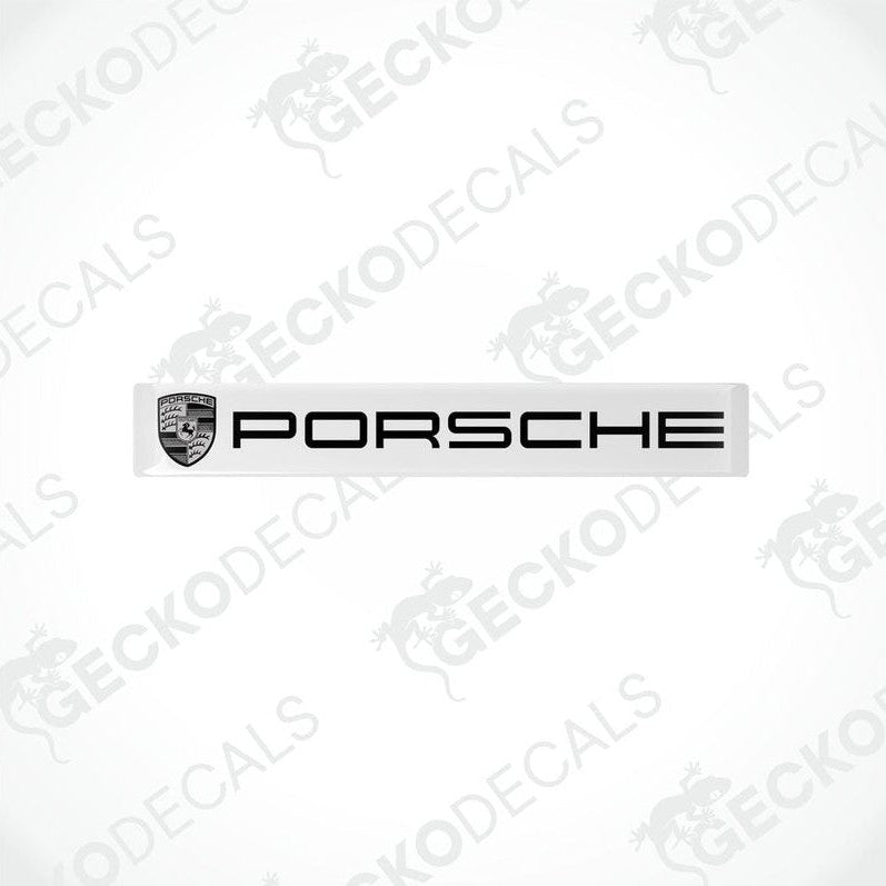 Withe vinyl stickers with the Porsche brand logo in black.