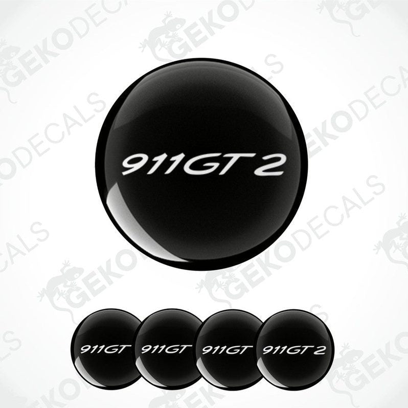 A set of four black vinyl stickers with the text '911 GT2' embossed on them, displayed against a white background.