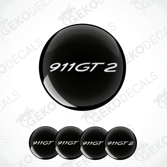 A set of four black vinyl stickers with the text '911 GT2' embossed on them, displayed against a white background.