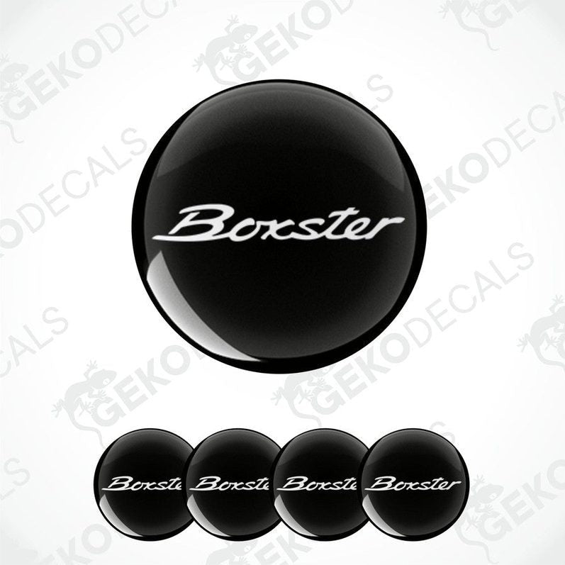 Set of four black round car decals with the text 'Boxster' on them, presented against a white background.