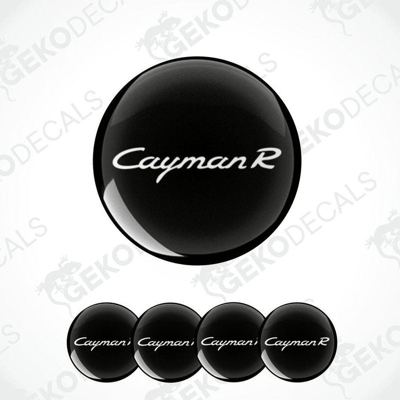 A set of four black vinyl stickers with the text 'CAYMAN R' on a white background.
